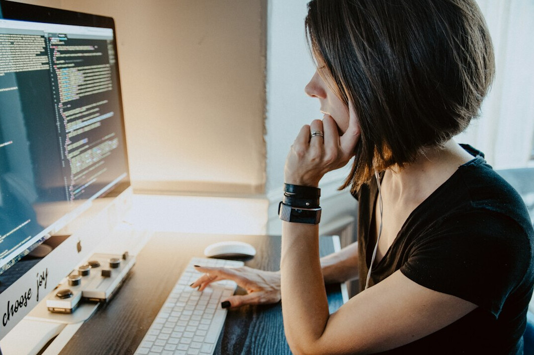 programmer coding at desk
